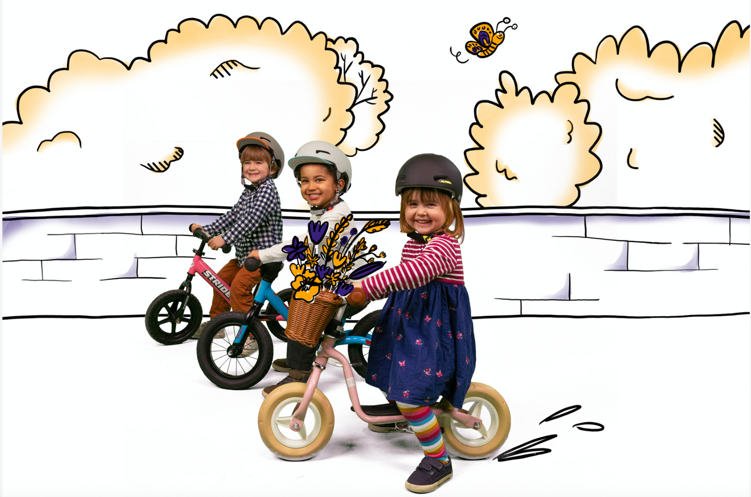 3 Kinder auf Laufrädern, ein Mädchen vorne mit Puky und Blumen im Korb, hinten zwei Jungs mit Puky und Strider